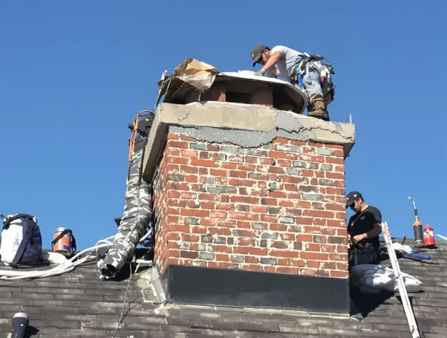 Tallmadge Chimney Sweep installing a custom chimney crown in Tallmadge, OH